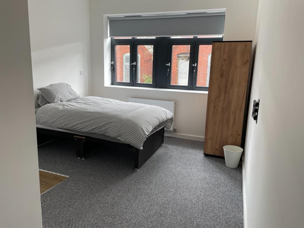 Clean neutral bedroom representing Sapphire Living Care property standards